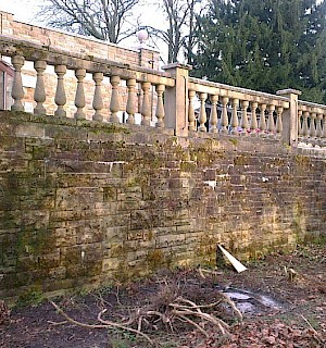 Steps and balustrade stone wall before